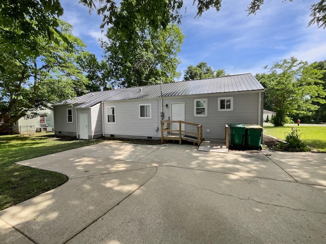 948 Oak St, Lewisburg, TN 37091 - back of property with a patio, a lawn, crawl space, and metal roof