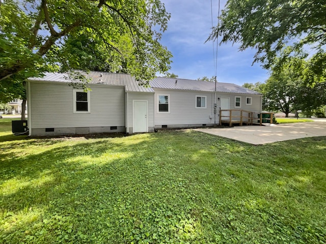 948 Oak St, Lewisburg, TN 37091 - back of property featuring crawl space, a yard, metal roof, and a patio