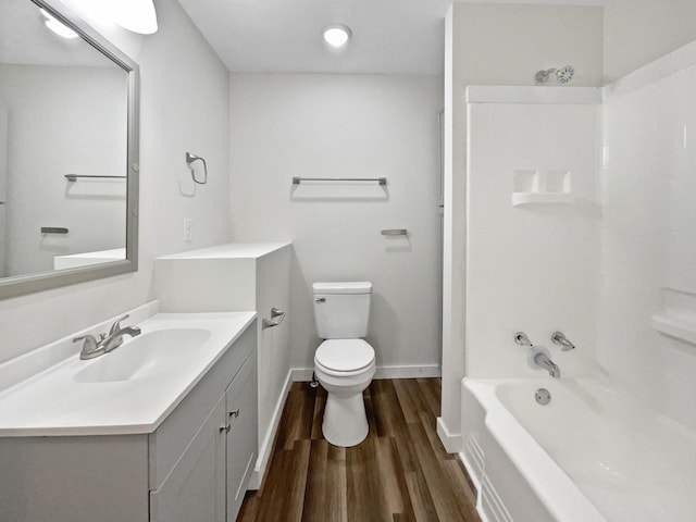 948 Oak St, Lewisburg, TN 37091 - full bathroom featuring wood finished floors, toilet, vanity, baseboards, and  shower combination