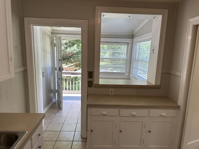 2910 Woodlawn Dr, Nashville, TN 37215 - doorway to outside with crown molding and light tile patterned floors