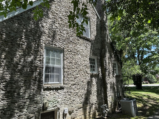 2910 Woodlawn Dr, Nashville, TN 37215 - view of side of home featuring stone siding and central AC