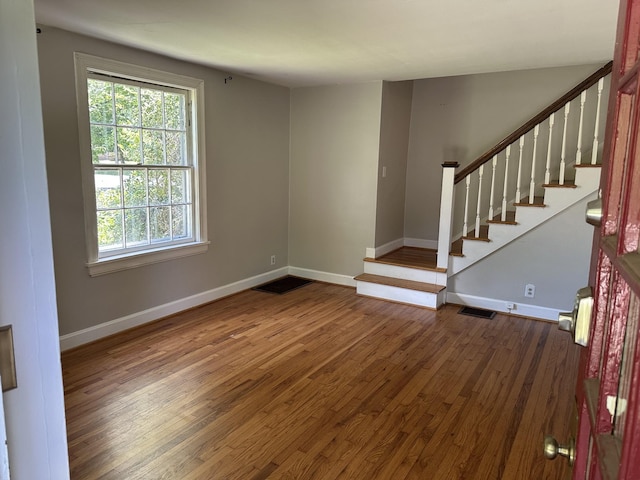 2910 Woodlawn Dr, Nashville, TN 37215 - spare room with dark wood-type flooring, baseboards, and stairway