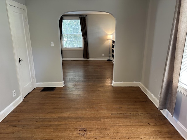 2910 Woodlawn Dr, Nashville, TN 37215 - hall featuring arched walkways, baseboards, and dark wood-style floors