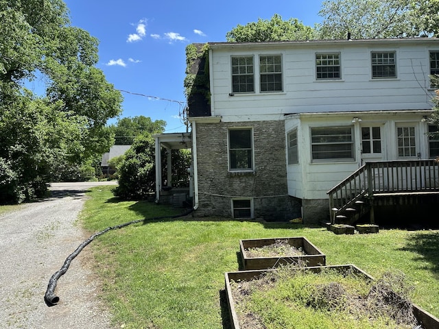 2910 Woodlawn Dr, Nashville, TN 37215 - rear view of property featuring a yard and a garden
