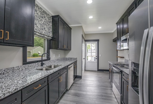 601 Lawrence St, Old Hickory, TN 37138 - kitchen featuring appliances with stainless steel finishes, a sink, healthy amount of natural light, light stone countertops, and recessed lighting