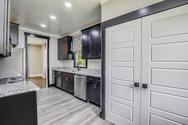 601 Lawrence St, Old Hickory, TN 37138 - kitchen with appliances with stainless steel finishes, recessed lighting, light wood-type flooring, a sink, and light stone counters