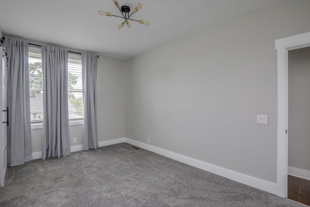 601 Lawrence St, Old Hickory, TN 37138 - spare room with a chandelier, baseboards, and carpet floors