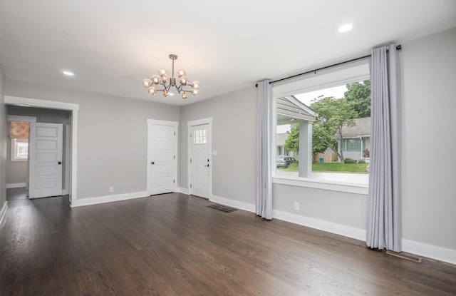 601 Lawrence St, Old Hickory, TN 37138 - unfurnished living room featuring a chandelier, dark wood-style floors, baseboards, and recessed lighting