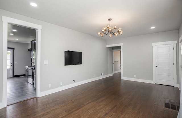 601 Lawrence St, Old Hickory, TN 37138 - unfurnished living room featuring a chandelier, dark wood-style floors, recessed lighting, and baseboards