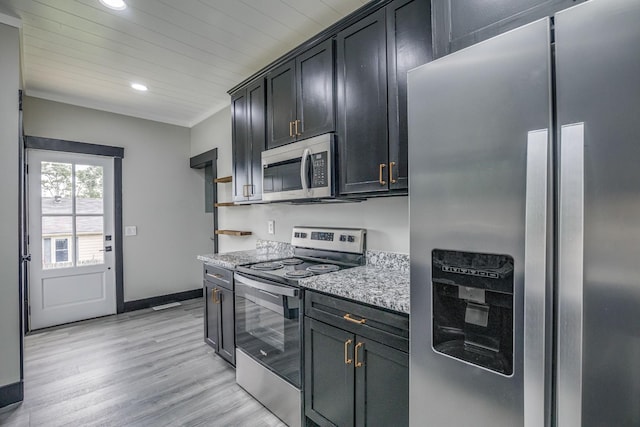 601 Lawrence St, Old Hickory, TN 37138 - kitchen with appliances with stainless steel finishes, recessed lighting, light stone countertops, light wood finished floors, and baseboards