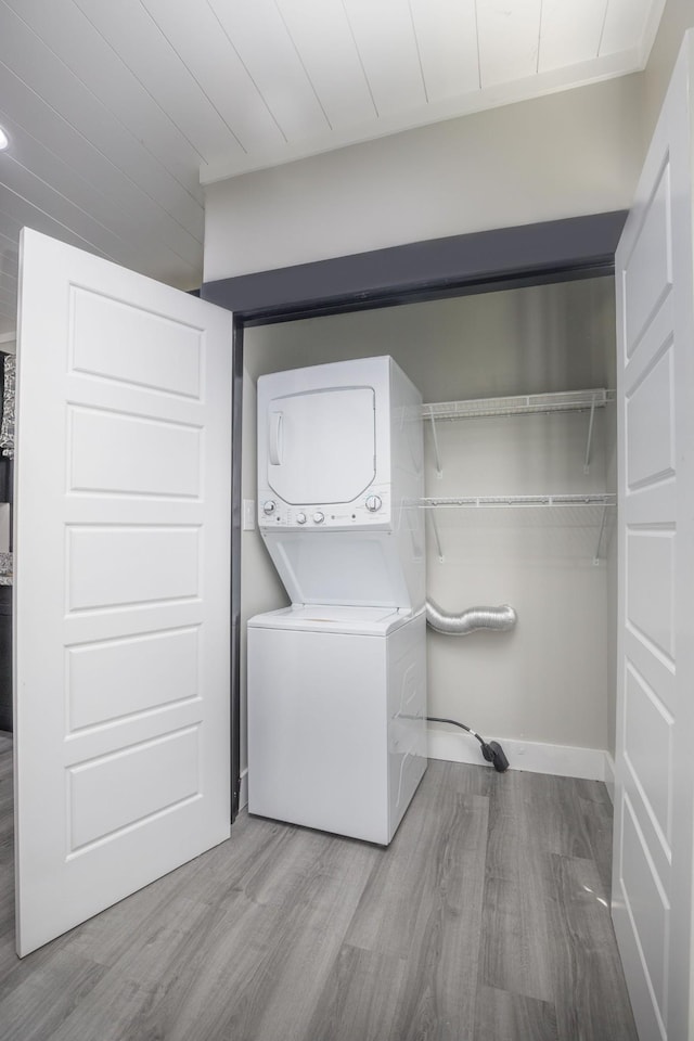 601 Lawrence St, Old Hickory, TN 37138 - laundry room featuring estacked washer and dryer, wood finished floors, and baseboards