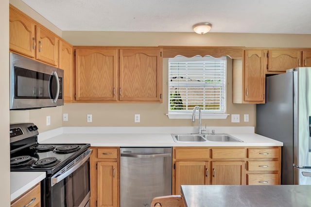 204 Nathan Dr, Goodlettsville, TN 37072 - kitchen featuring appliances with stainless steel finishes, a sink, and light countertops