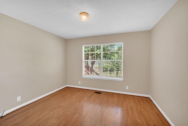 204 Nathan Dr, Goodlettsville, TN 37072 - spare room with baseboards, wood finished floors, and a textured ceiling