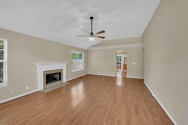 204 Nathan Dr, Goodlettsville, TN 37072 - unfurnished living room with ceiling fan, light wood finished floors, a fireplace with flush hearth, lofted ceiling, and baseboards