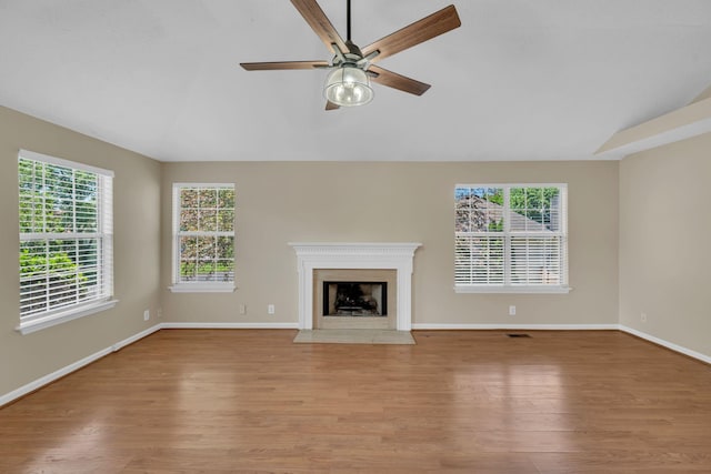 204 Nathan Dr, Goodlettsville, TN 37072 - unfurnished living room with light wood-style floors, plenty of natural light, lofted ceiling, ceiling fan, and baseboards