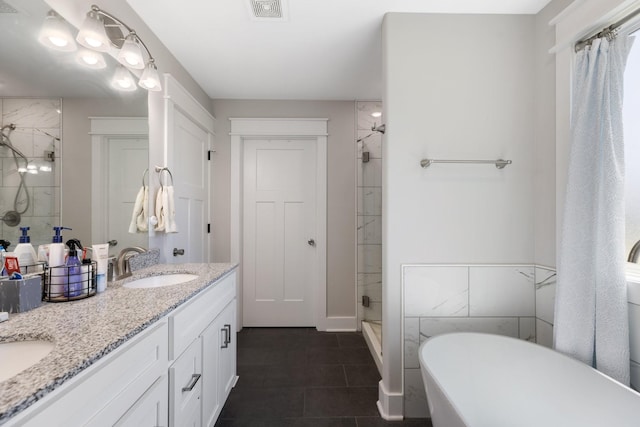 3021 Cambridge Ct, Lewisburg, TN 37091 - bathroom with a shower stall, double vanity, a freestanding tub, and tile patterned flooring