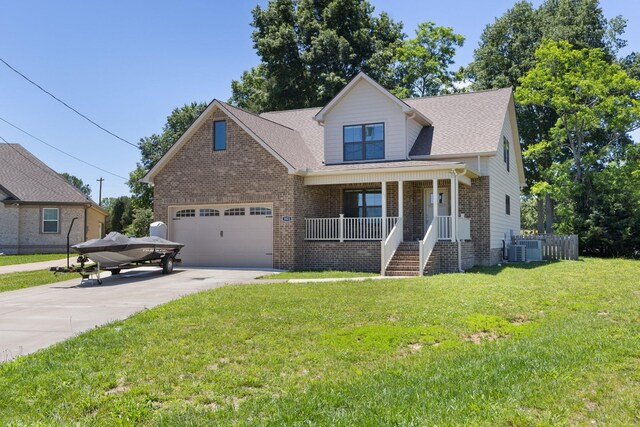3021 Cambridge Ct, Lewisburg, TN 37091 - view of front of home featuring a porch, concrete driveway, a front lawn, brick siding, and central air condition unit