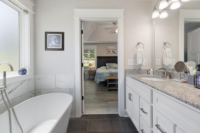 3021 Cambridge Ct, Lewisburg, TN 37091 - bathroom with tile patterned floors, vanity, a ceiling fan, ensuite bath, and a soaking tub