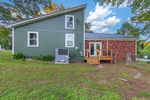 2897 Old Medina Rd, Jackson, TN 38305 - rear view of house featuring crawl space, a wooden deck, cooling unit, and metal roof