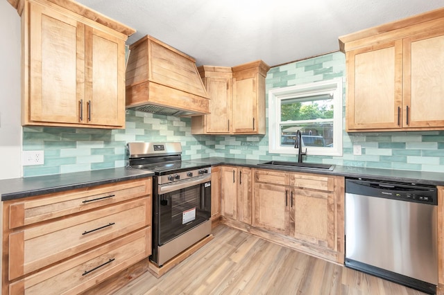 2897 Old Medina Rd, Jackson, TN 38305 - kitchen with appliances with stainless steel finishes, a sink, and light brown cabinetry