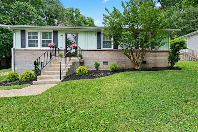 110 Rainbow Cir, Columbia, TN 38401 - view of front facade featuring brick siding, a front lawn, and crawl space