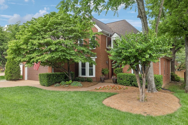 320 Julianna Cir, Franklin, TN 37064 - view of front of property featuring brick siding, a front yard, driveway, and a garage