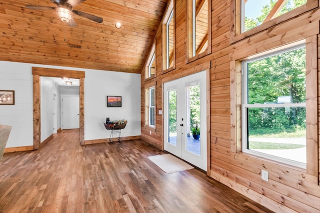 1055 Hunters Landing Ln, Smithville, TN 37166 - entrance foyer with baseboards, wood finished floors, a ceiling fan, wood walls, and high vaulted ceiling
