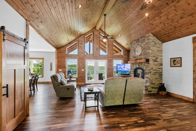 1055 Hunters Landing Ln, Smithville, TN 37166 - living room with ceiling fan, dark wood-style floors, a barn door, baseboards, and high vaulted ceiling