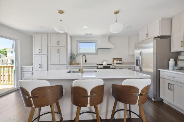 901 Elliston St, Old Hickory, TN 37138 - kitchen featuring custom range hood, a sink, stainless steel appliances, light countertops, and a kitchen bar