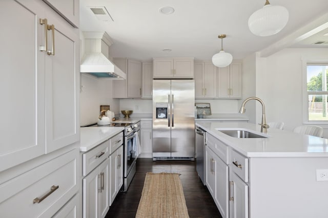 901 Elliston St, Old Hickory, TN 37138 - kitchen featuring stainless steel appliances, a sink, custom exhaust hood, light countertops, and a kitchen island with sink