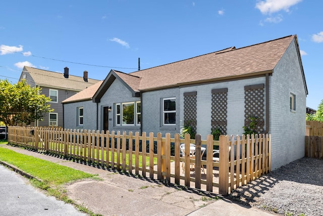 901 Elliston St, Old Hickory, TN 37138 - view of front of property featuring a shingled roof, brick siding, and a fenced front yard