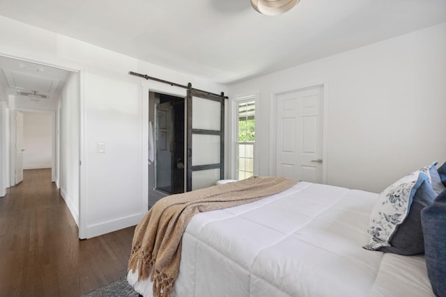 901 Elliston St, Old Hickory, TN 37138 - bedroom featuring wood finished floors, attic access, baseboards, and a barn door