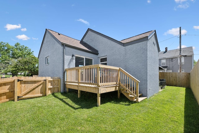 901 Elliston St, Old Hickory, TN 37138 - back of property featuring brick siding, a wooden deck, and a gate