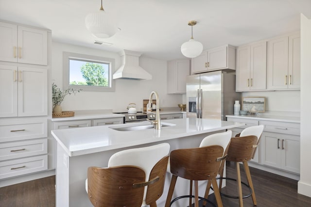 901 Elliston St, Old Hickory, TN 37138 - kitchen featuring premium range hood, stainless steel fridge, a sink, a breakfast bar, and light countertops