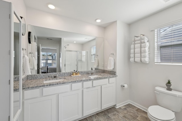 1507 Ashgrove Pl, Lebanon, TN 37087 - full bath with double vanity, baseboards, healthy amount of natural light, toilet, and recessed lighting