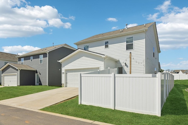 1507 Ashgrove Pl, Lebanon, TN 37087 - rear view of house with driveway and an attached garage