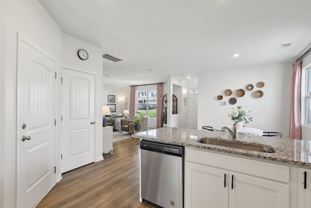 1507 Ashgrove Pl, Lebanon, TN 37087 - kitchen with stainless steel dishwasher, a sink, white cabinetry, light stone countertops, and wood finished floors