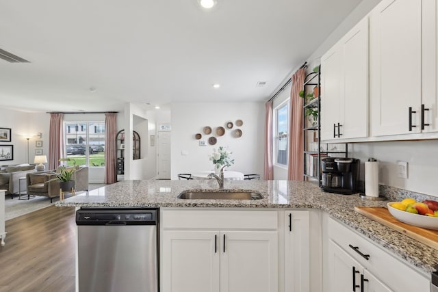 1507 Ashgrove Pl, Lebanon, TN 37087 - kitchen featuring dishwasher, a peninsula, a sink, open floor plan, and white cabinetry