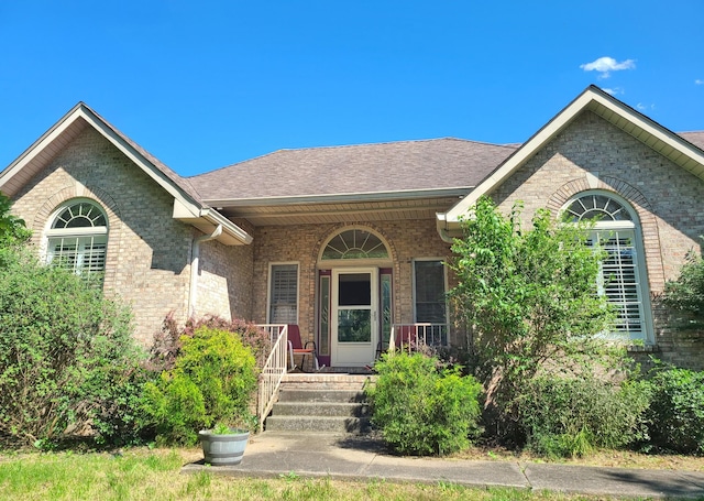 305 Lenox Ct, Springfield, TN 37172 - ranch-style house with brick siding, a porch, and roof with shingles
