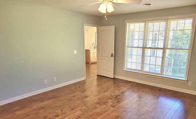 305 Lenox Ct, Springfield, TN 37172 - empty room featuring a ceiling fan, dark wood finished floors, and plenty of natural light