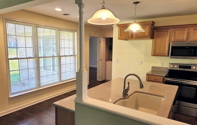 305 Lenox Ct, Springfield, TN 37172 - kitchen with stainless steel appliances, brown cabinets, healthy amount of natural light, decorative light fixtures, and recessed lighting