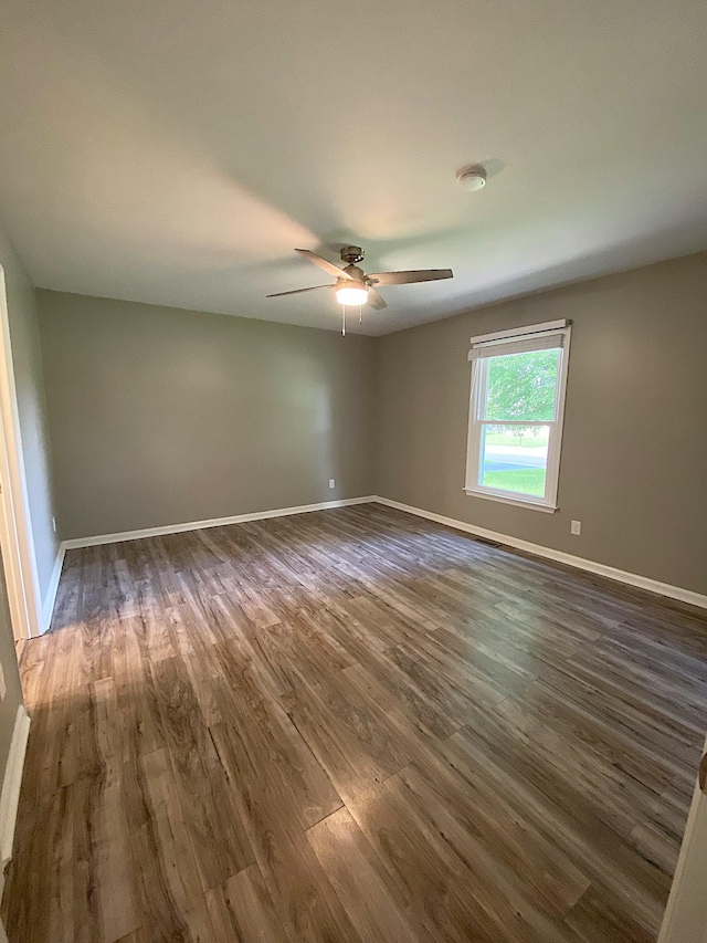 1834 Venada Trl, Murfreesboro, TN 37128 - empty room with dark wood-type flooring, a ceiling fan, and baseboards