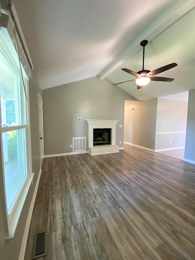 1834 Venada Trl, Murfreesboro, TN 37128 - unfurnished living room with dark wood-style flooring, a ceiling fan, a brick fireplace, and baseboards