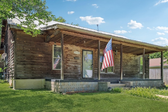 102 Nall Ave, Centerville, TN 37033 - entrance to property featuring metal roof and a lawn