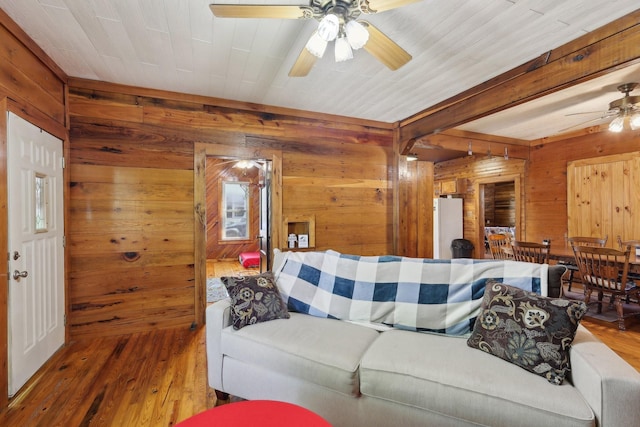 102 Nall Ave, Centerville, TN 37033 - living area featuring a ceiling fan, wood walls, wood-type flooring, and beam ceiling