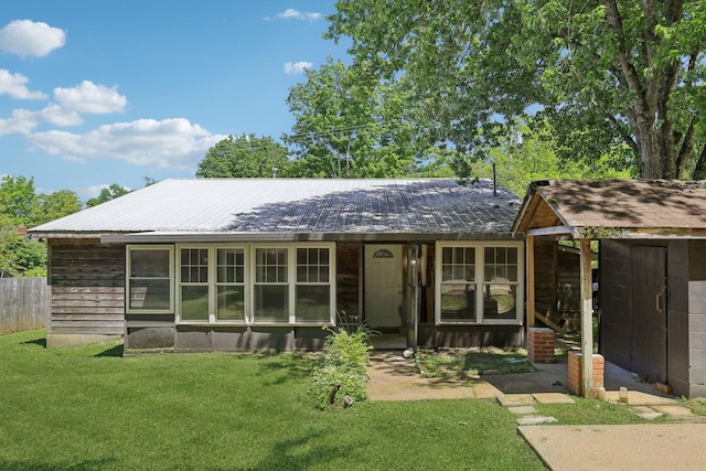 102 Nall Ave, Centerville, TN 37033 - back of house with a yard and metal roof