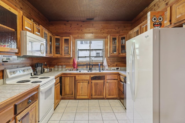 102 Nall Ave, Centerville, TN 37033 - kitchen with white appliances, a sink, tile counters, brown cabinets, and light tile patterned floors