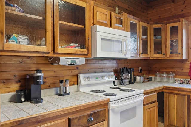 102 Nall Ave, Centerville, TN 37033 - kitchen featuring white appliances, glass insert cabinets, brown cabinetry, and tile counters