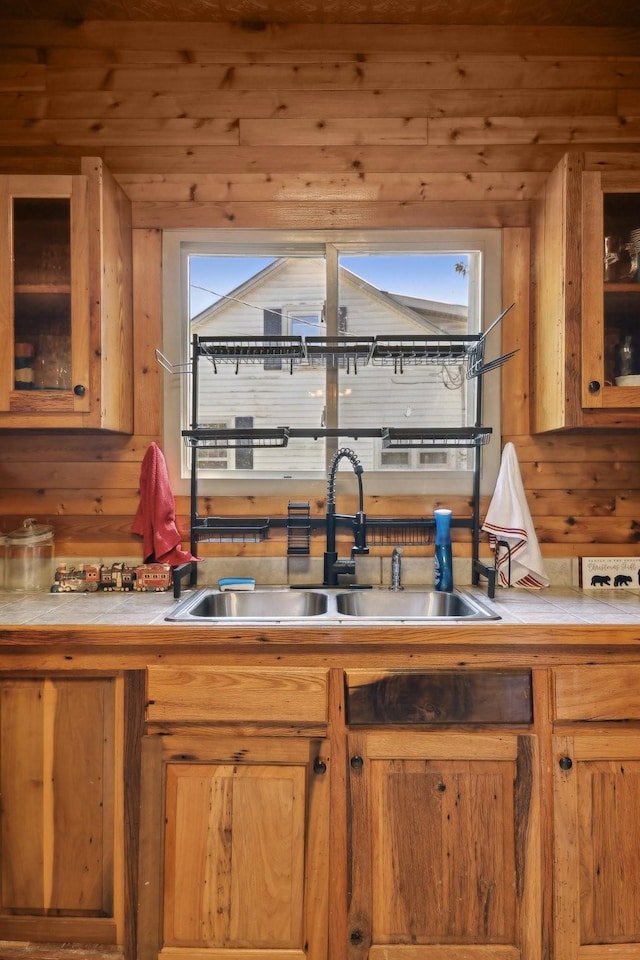 102 Nall Ave, Centerville, TN 37033 - kitchen with tile countertops, a sink, and glass insert cabinets