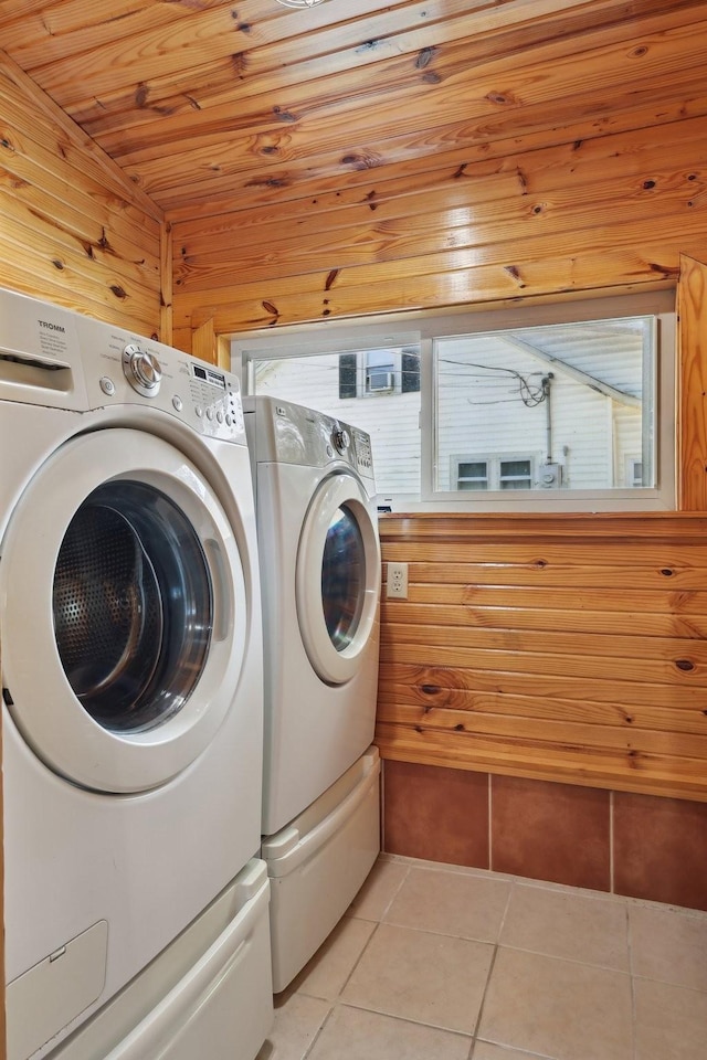 102 Nall Ave, Centerville, TN 37033 - laundry room with washer and dryer, light tile patterned flooring, wood ceiling, and wood walls